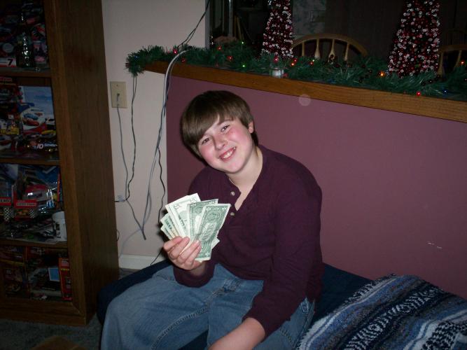 Jamie showing off money he got for christmas